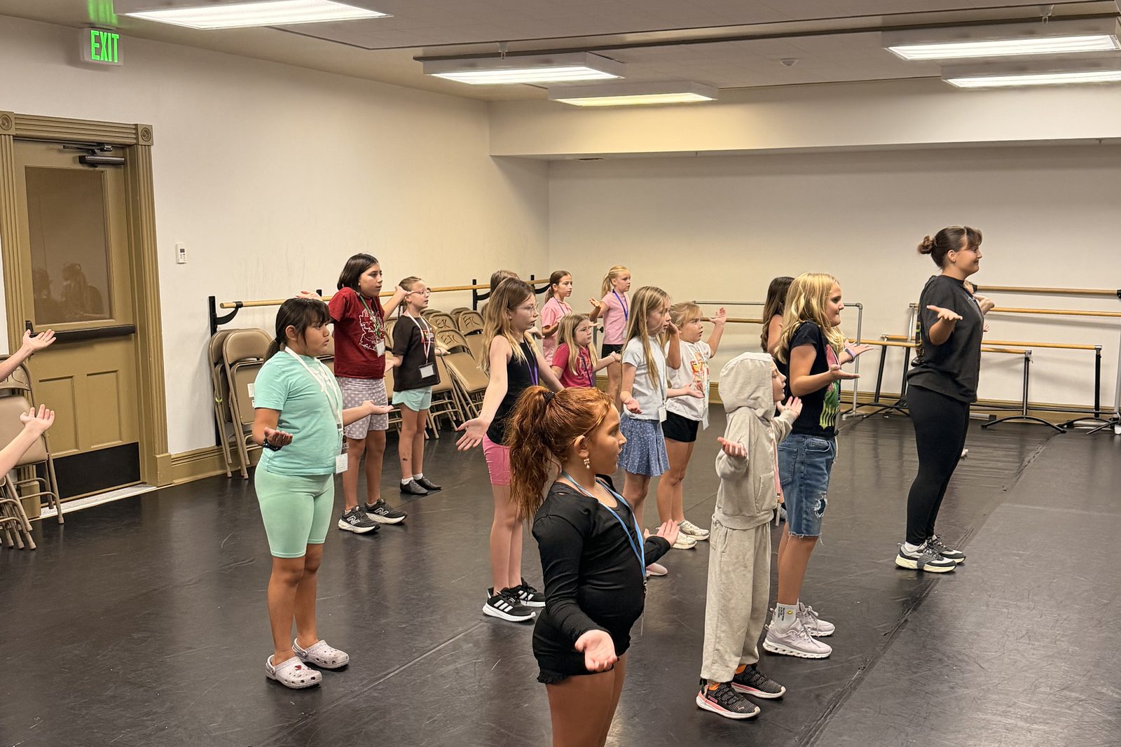 Young Artists learning choreography in the rehearsal room on day one of camp