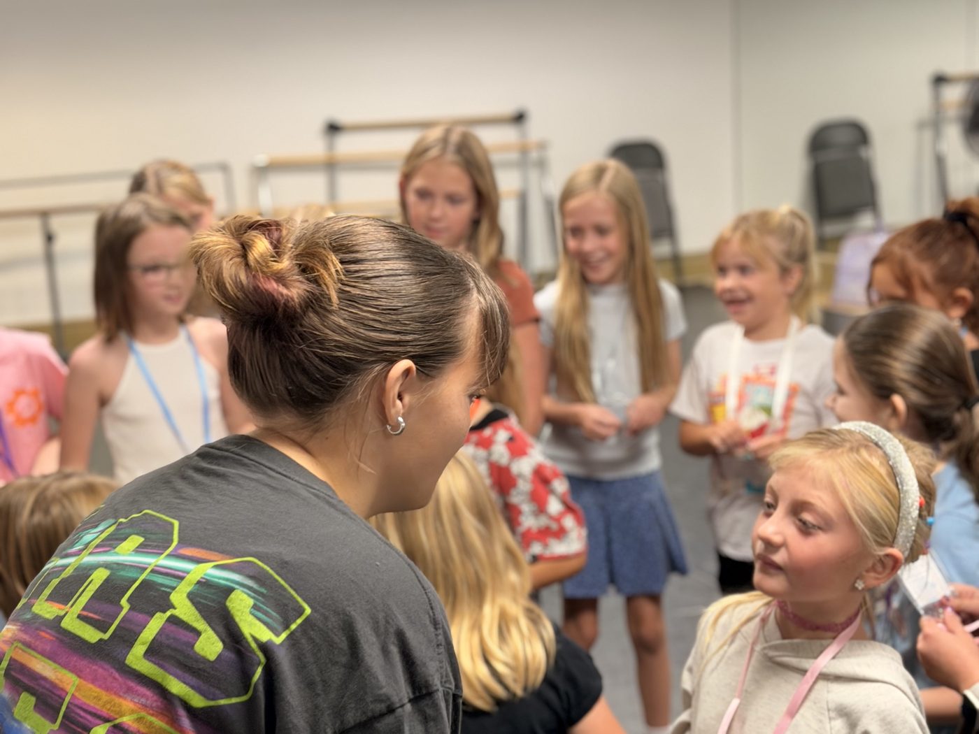 A youth leader talking with a camper before the session begins