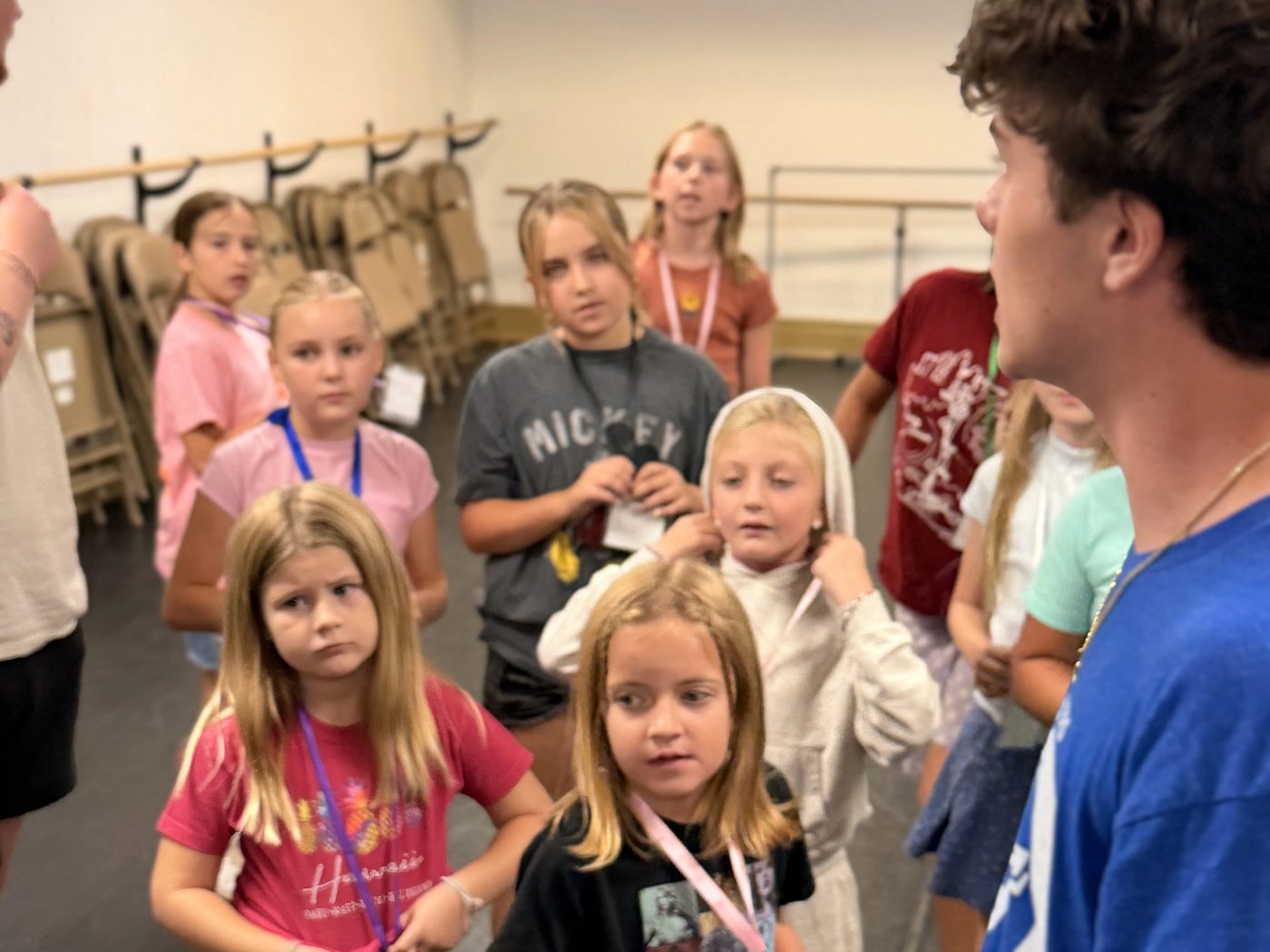 A youth leader working with campers during the week