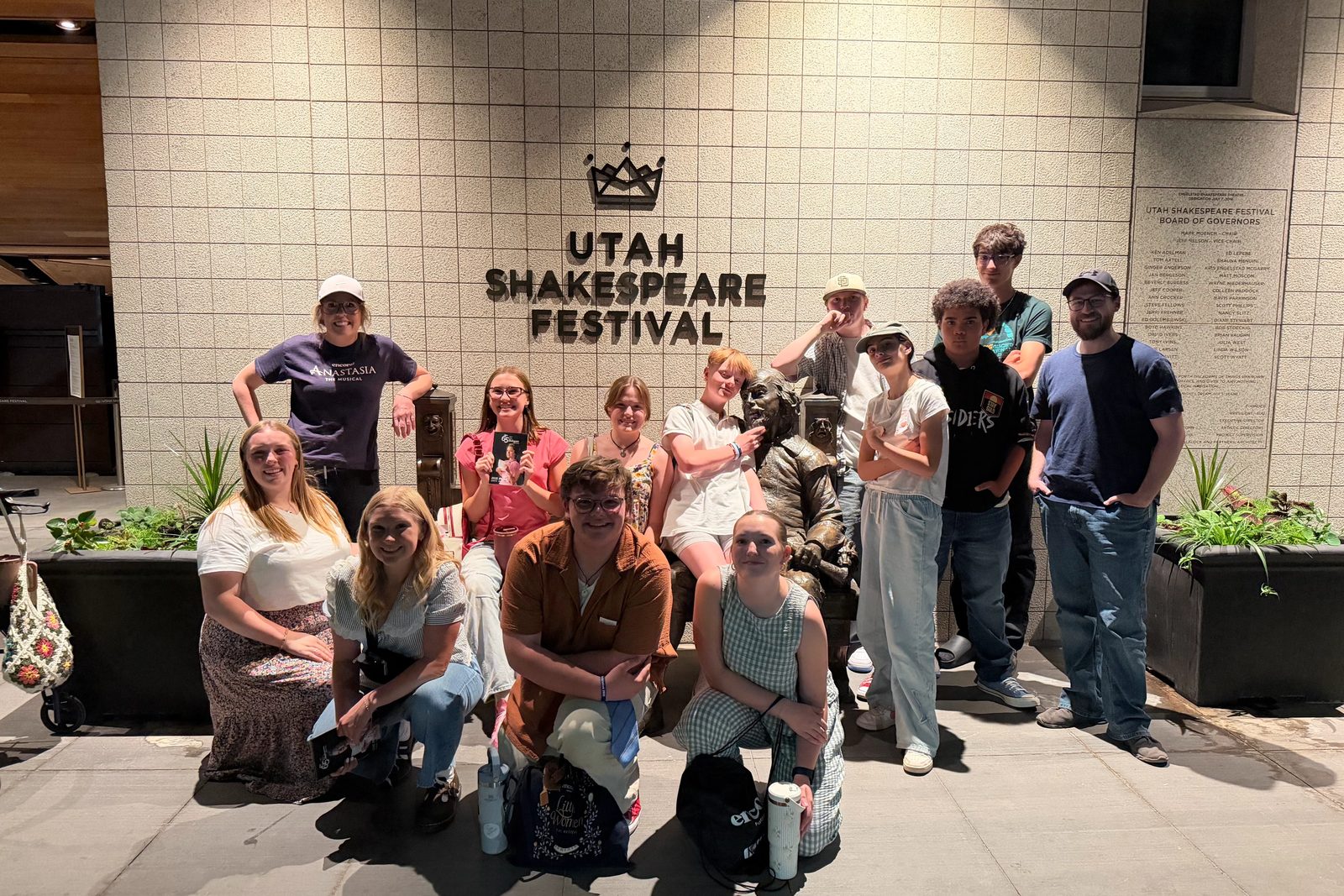 Encore Young Artists gathered beneath the Utah Shakespeare Festival sign in Cedar City