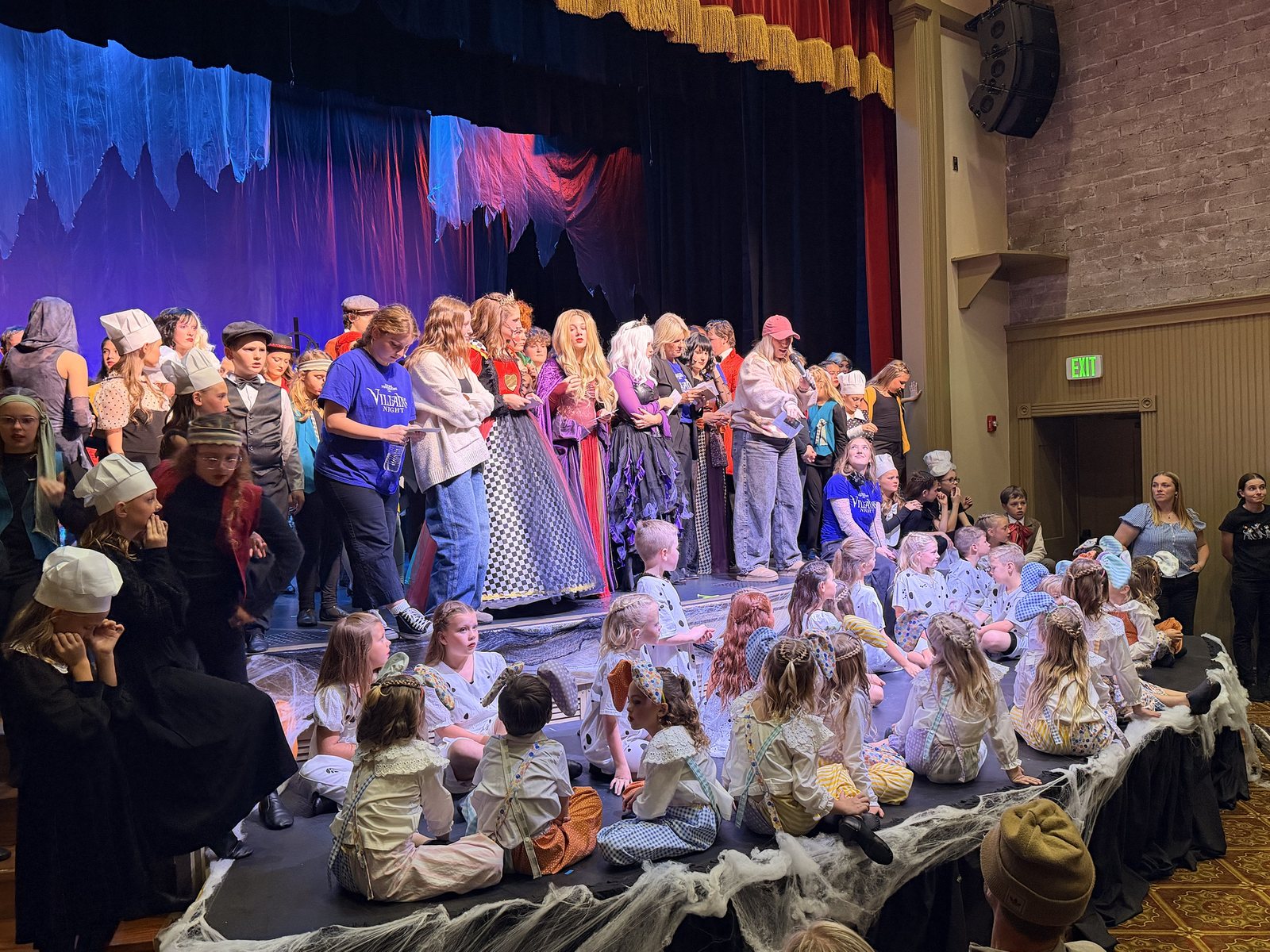 The full Villains Night company filling the Electric Theater stage at curtain call