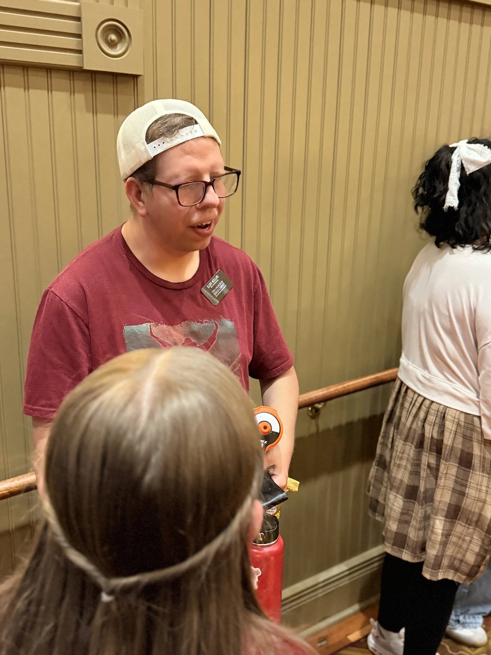 A guest talking with members of the company after the show