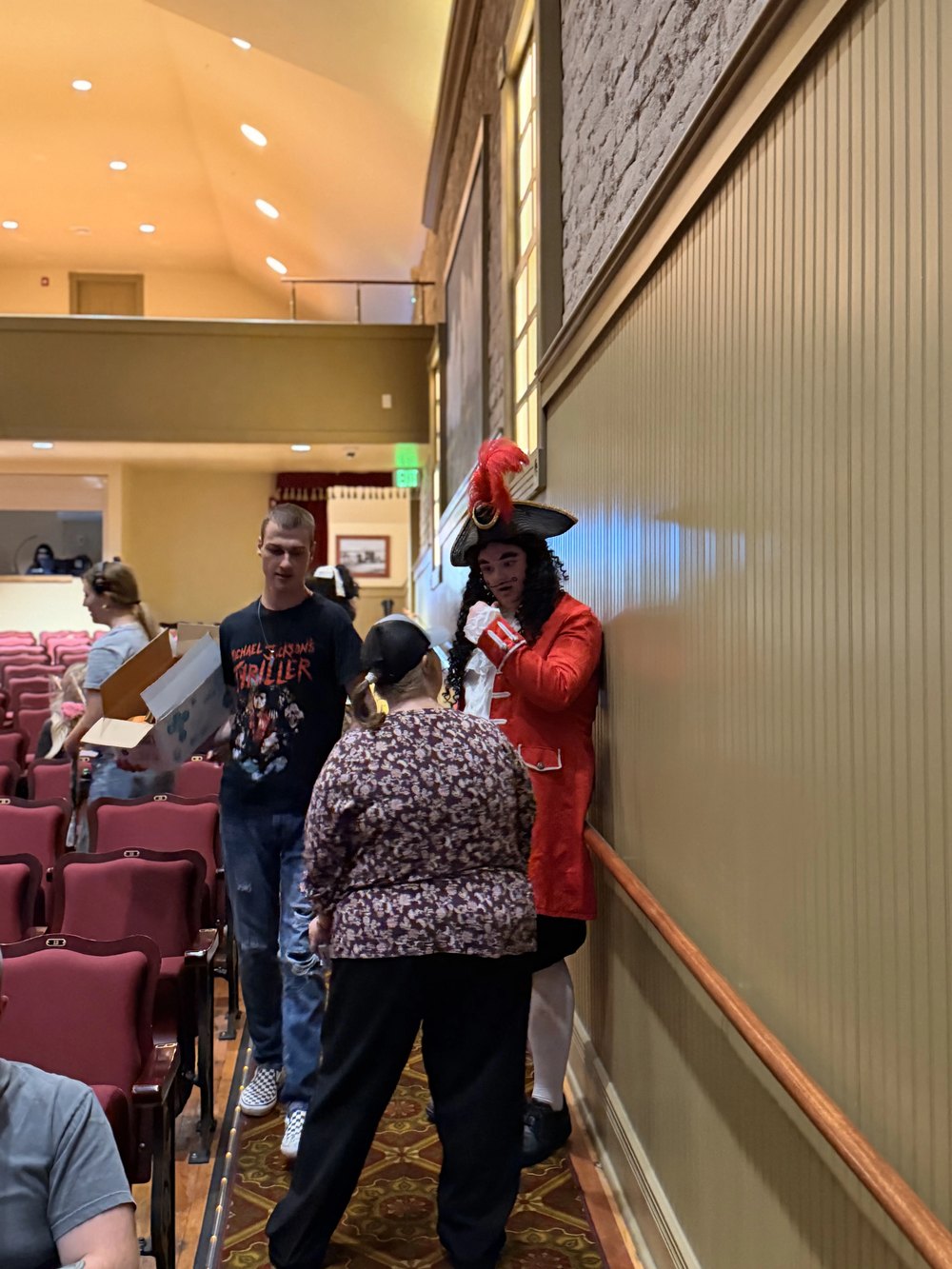 Captain Hook greeting guests in the aisle of the Electric Theater