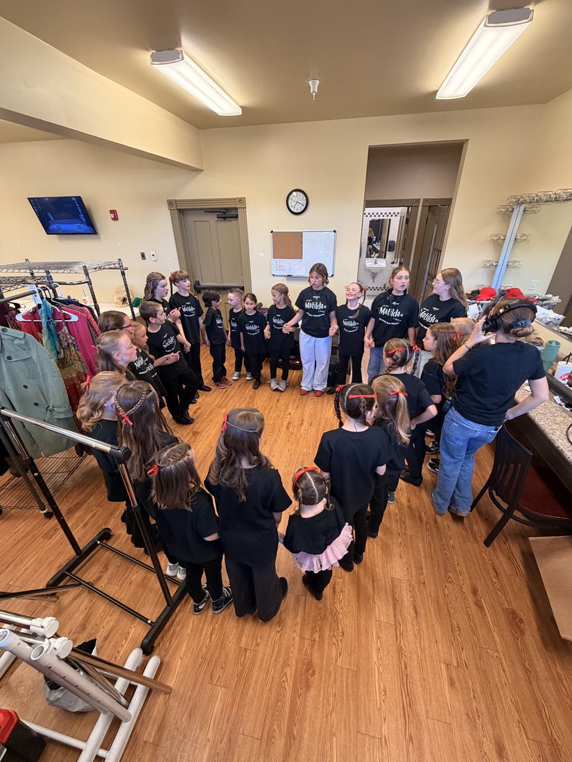Young Artists gathered in a circle at an Encore theater camp