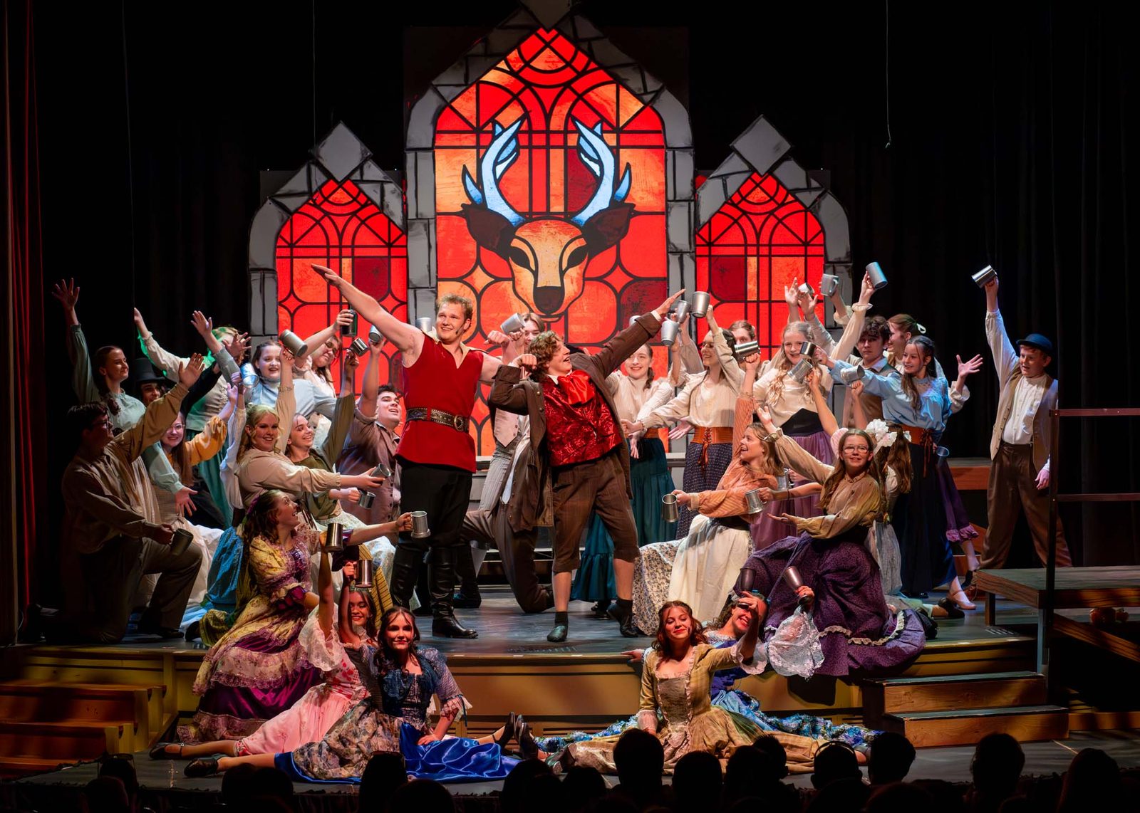 Encore performers in a tavern scene from Beauty and the Beast