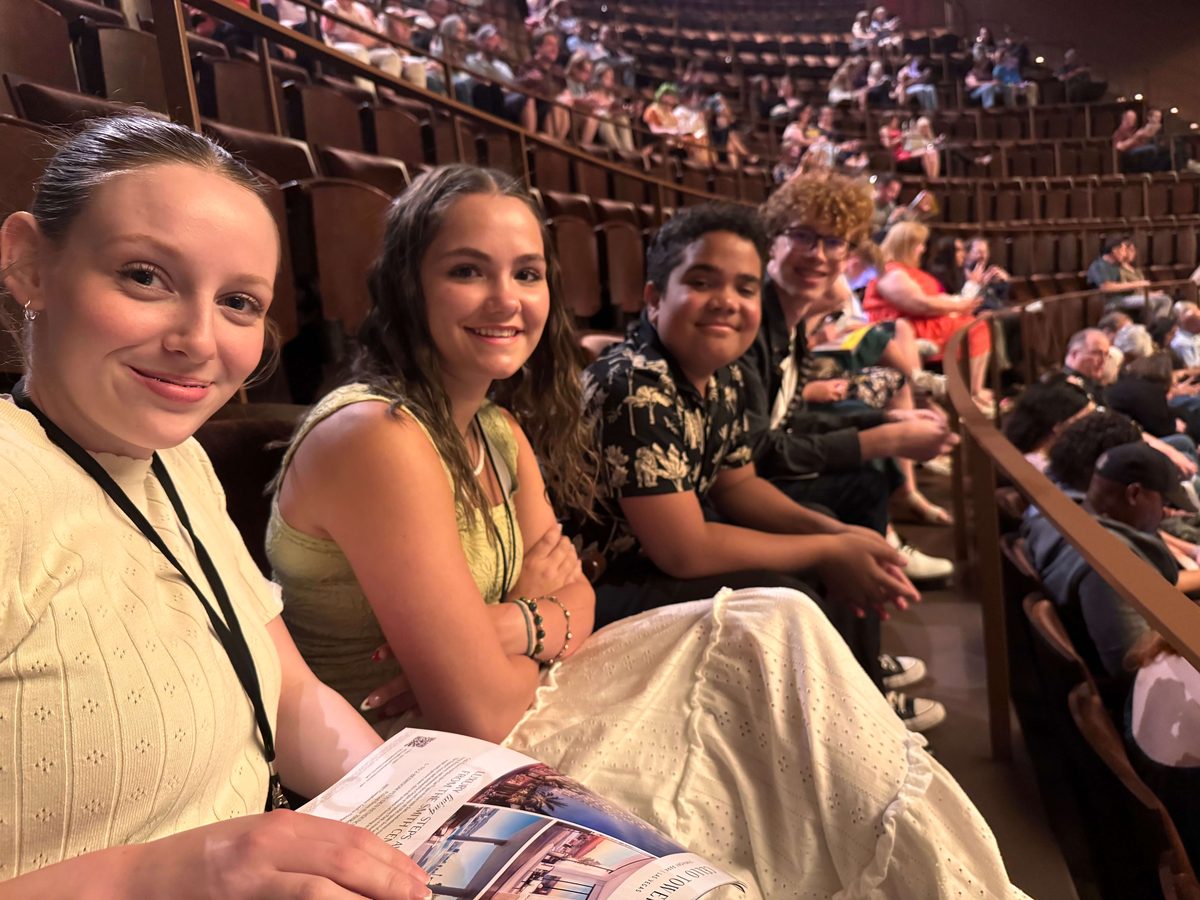 Encore Young Artists in the audience at a Page to Stage theater field trip